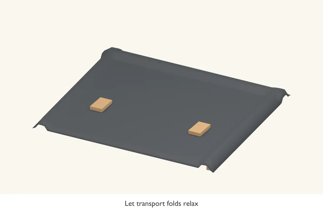 Leave the sheet relaxed and centred before bonding it. Smooth temporary weights keep its position.