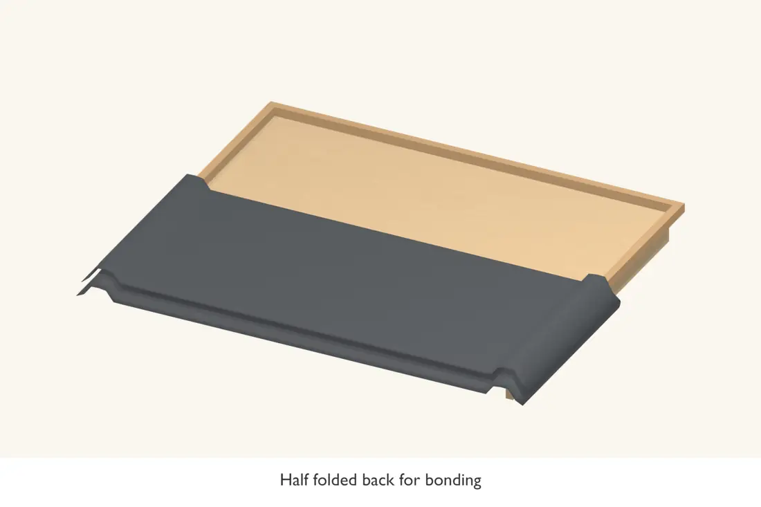 Fold back part of the sheet to expose the deck without losing the alignment.